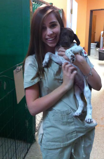Senior Kelsey Donnell spends time with Okie, a 7-week-old German Pointer. 