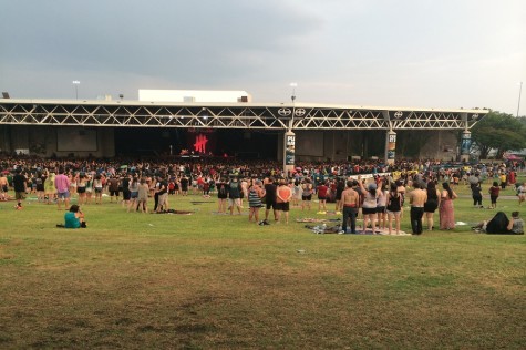 Rain clouds pass over drenched fans at the Gexa Energy Pavilion.