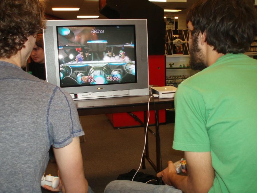 Two Smash gamers play against each other in Project M using the characters Fox and Luigi. Photo by Min Ji Kim. 