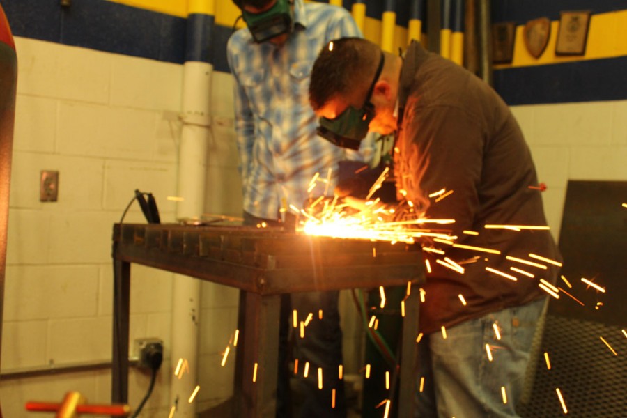 A student uses a potentially dangerous tool during Molinas Ag Mechanics class. 