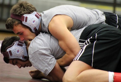 Senior Tanner Douglas breaks down his teammate to run a half nelson. He went on to win the match. Photo by Taylor Norris.