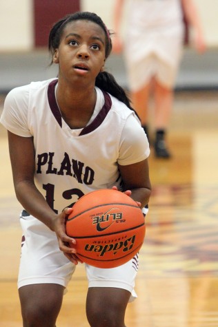 Junior guard Ania Henderson lines up for a free throw during the team's 50-49 win over Hebron on Dec. 5. Photo by Lara Hudson. 