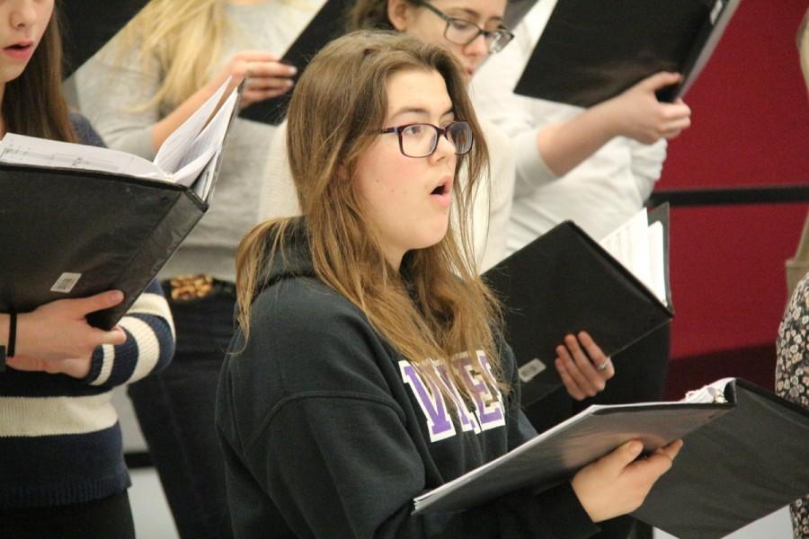 Junior Nancy Bortel practices music during her choir class.Weve worked really hard this year, Danielle Dewese said. Weve all been able to come together as a team with putting all of our voices together.
