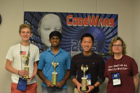 Casey Hopper, Nikhil Pandeti, and Jeremy Doan pose with their CompSci teacher Ms.Gallatin holding their trophies."When we won, I felt really happy," Doan said.  Submitted by Ms.Gallatin