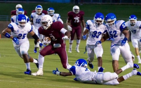 Stephens evades several would-be tacklers during the season's opening victory.