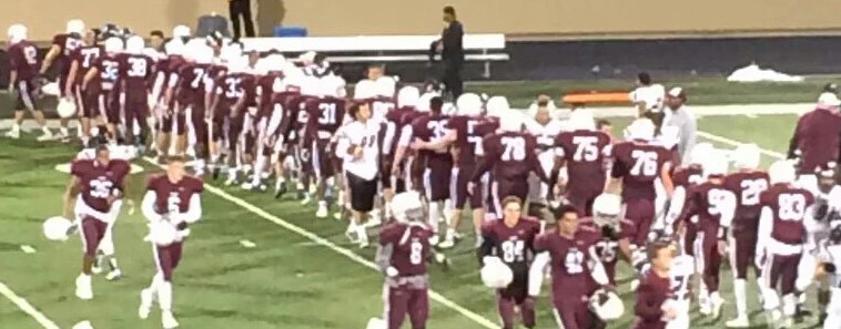 Plano and Lewisville players shake hands following their varsity football game on Nov. 6. (Photo by Plano QB Club) 