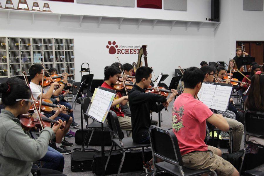 Orchestra students being conducted by guest teacher Jennifer Guffey. (Photo by Abby Zimmardi)
