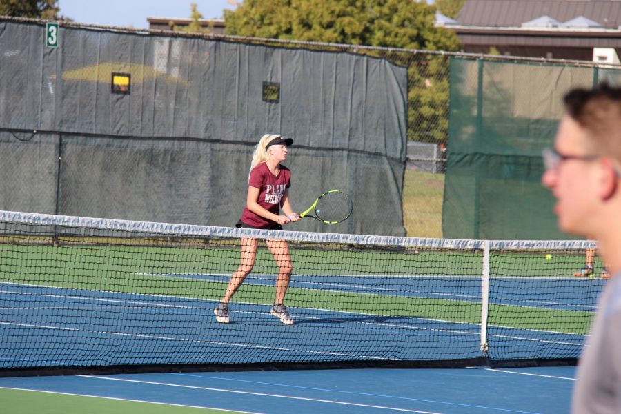 Junior Mikaela North waits for the ball during the district match.