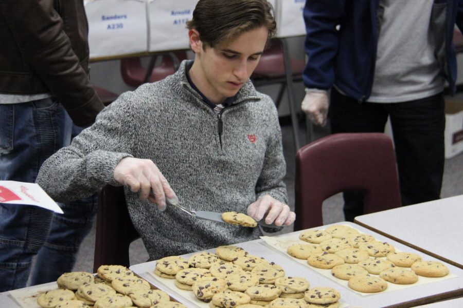 Senior Vince Buccini helps with DECA cookie fundraiser that helps pay for state. He was one of the 22 who put in time and effort to make it to state.