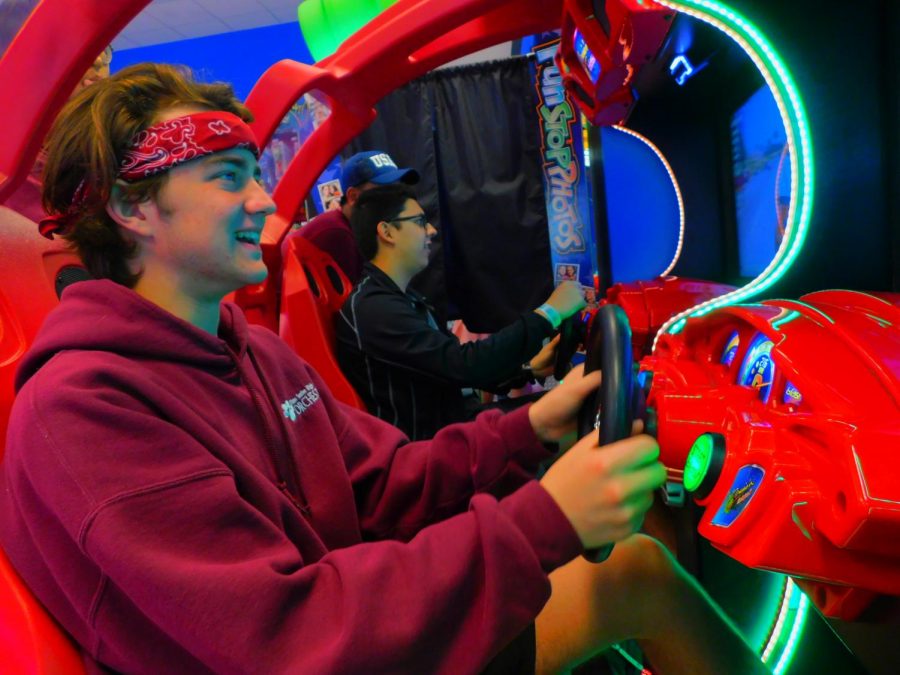 Juniors Jackson Freeman
and Daniel Restrepo play games at an arcade in
Branson, MO on the orchestra trip. (photo by
Ethan Nguyen)