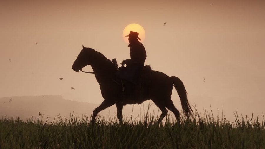 Cinematic+shot+of+a+lone+cowboy+riding+trusty+steed+at+sunset