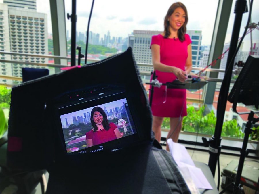 Elise Hu broadcast reporting from Singapore for National Public Radio Station.