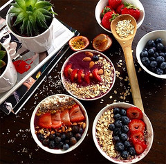 Healthy breakfast fruit bowl with nuts, fruits and
grains.