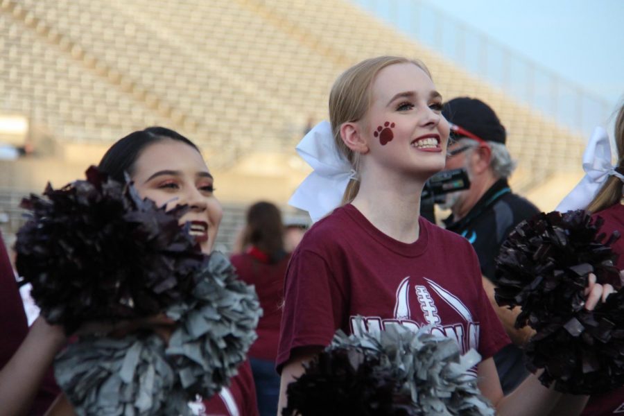 Alyssa+Franks+and+Karen+Linares+rally+the+crowd+at+a+game.