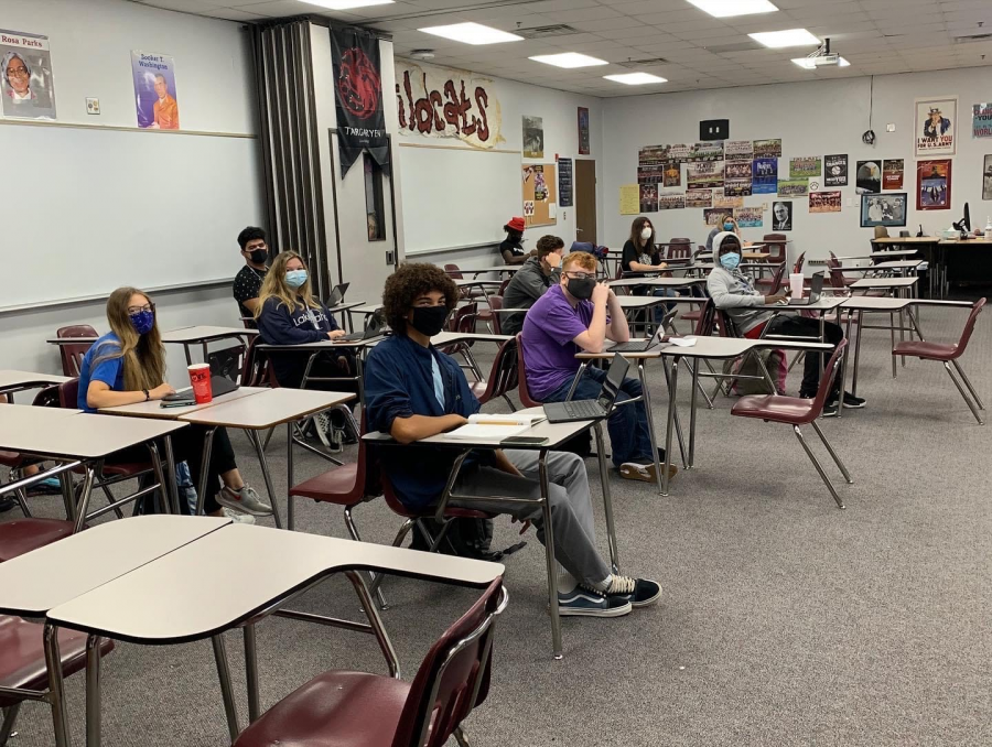 Students wear masks and social-distance while in the classroom.