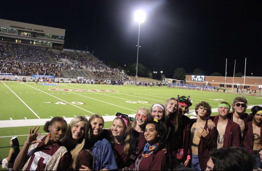 The Mamacitas and Blazer Boys lead the student section for the first game of the season.