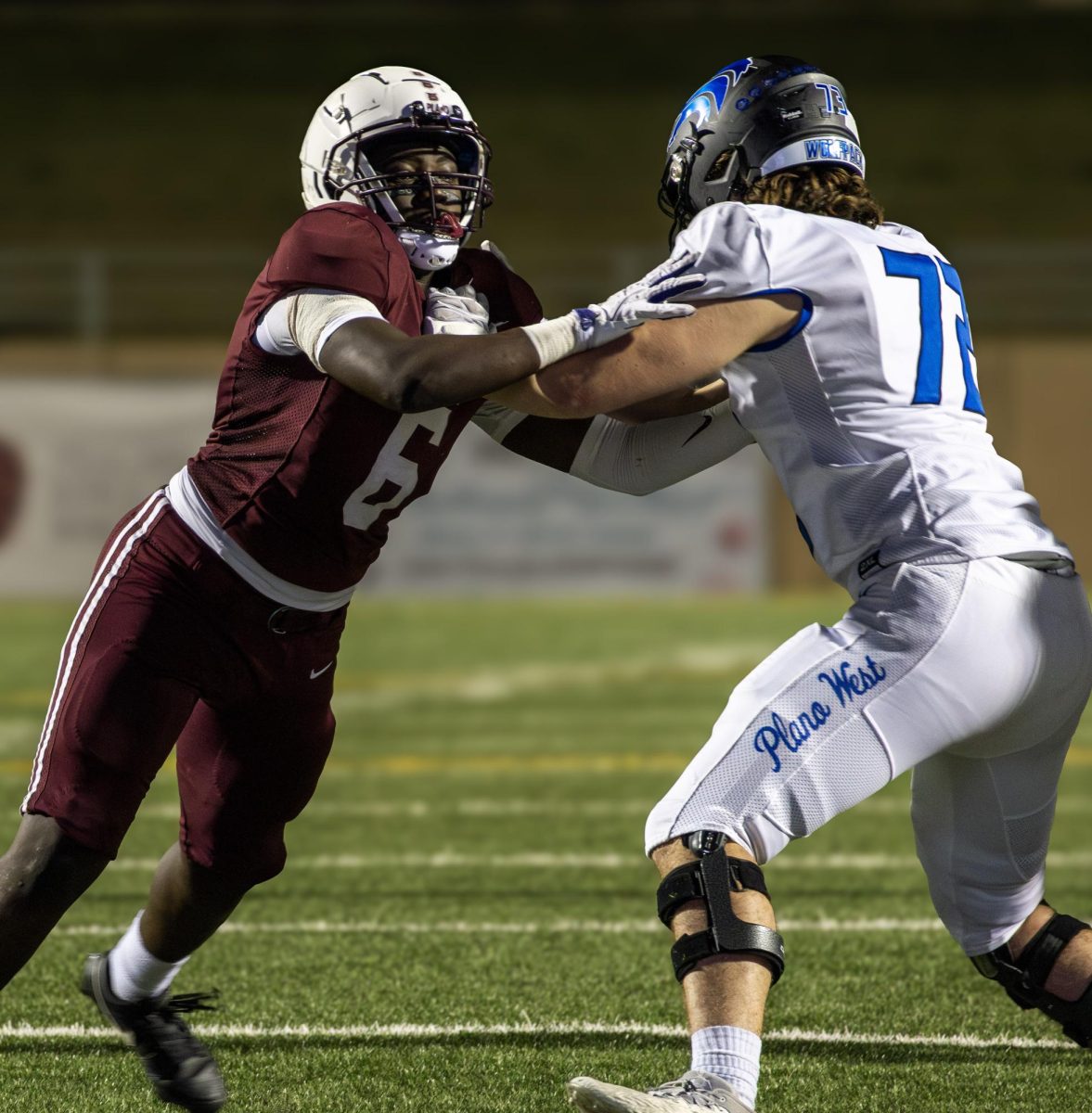 On Friday, Oct 3, 2025, the Plano Varsity Boys Football team lost their Plano: Clark Stadium(Main stadium) game against Plano West High School by a score of 14-35. Junior and Running Back Stephen Brown, number 6, pushes back against opponent J.J. Raecek.